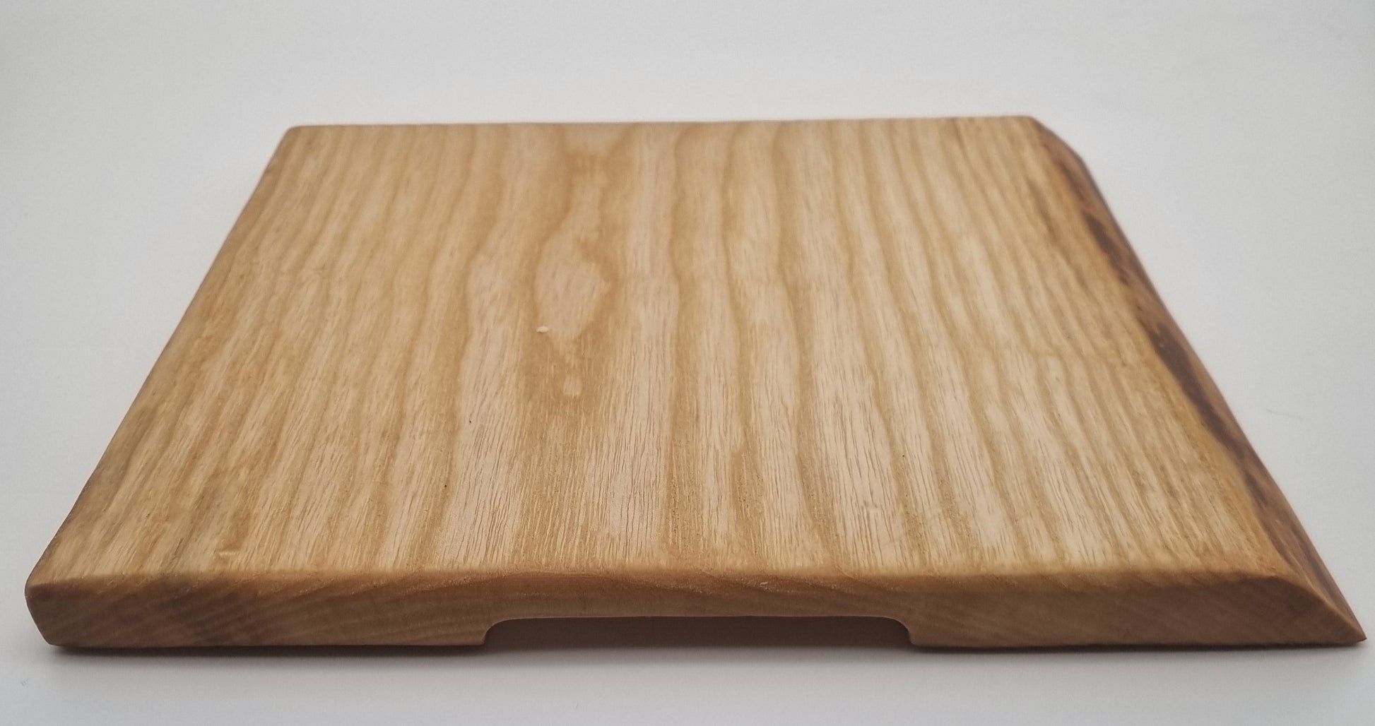 live edge serving board side view with handle