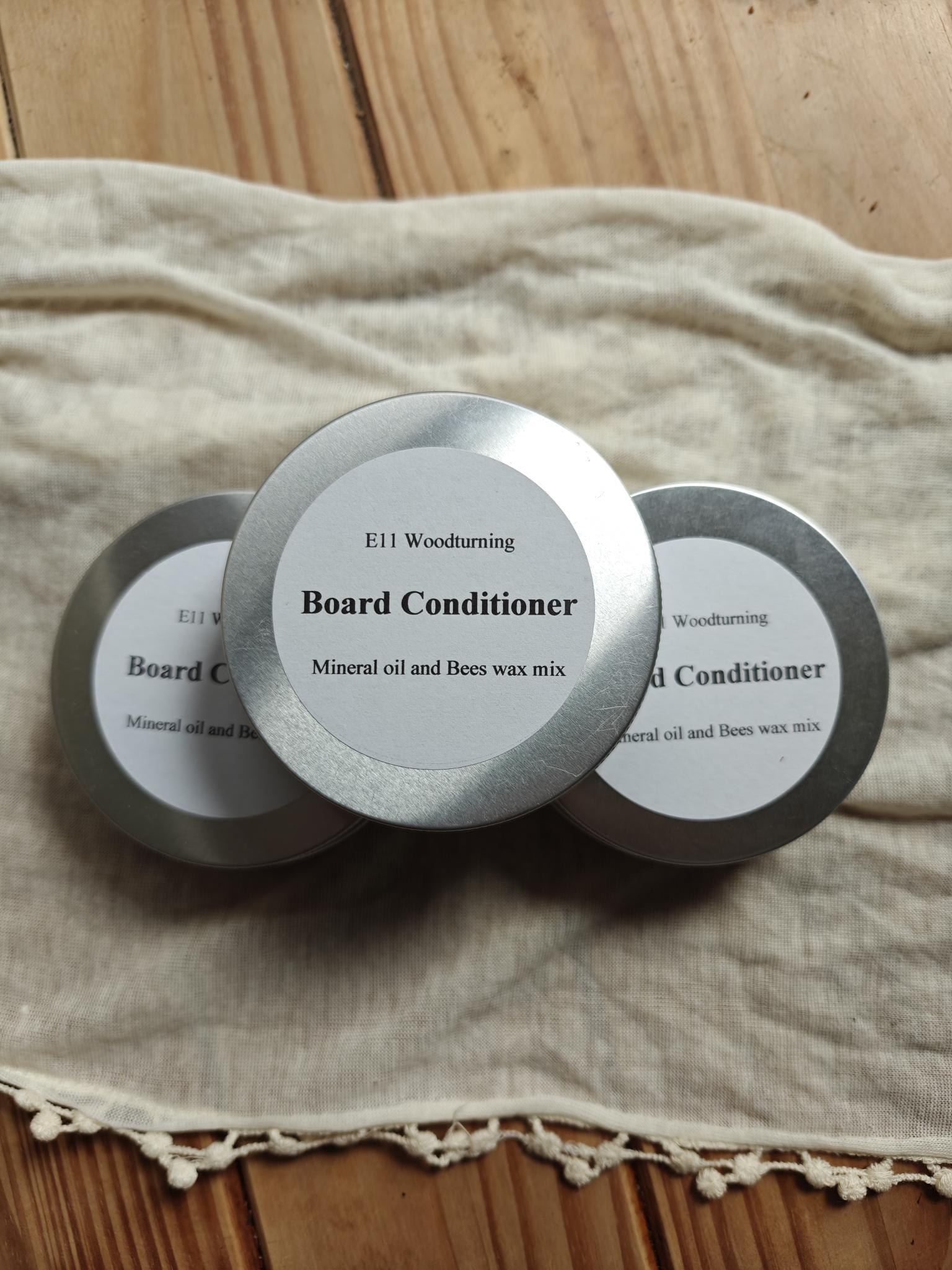 Three tins of board conditioner 